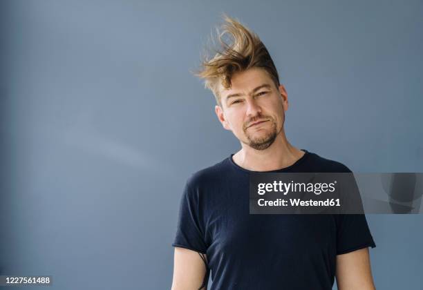 portrait of a bearded man with tousled hair - tousled hair fotografías e imágenes de stock