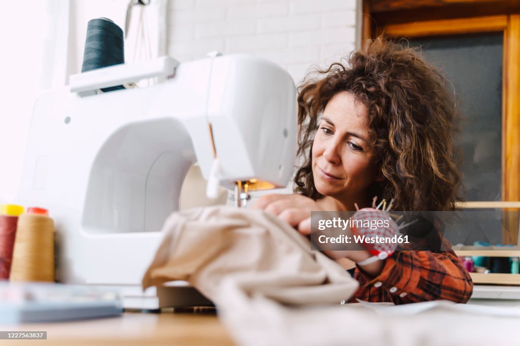 Woman sewing at home