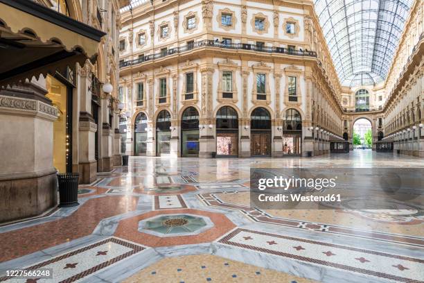 italy, milan, interior of galleriavittorioemanueleii during covid-19 outbreak - galleria vittorio emanuele ii stock pictures, royalty-free photos & images