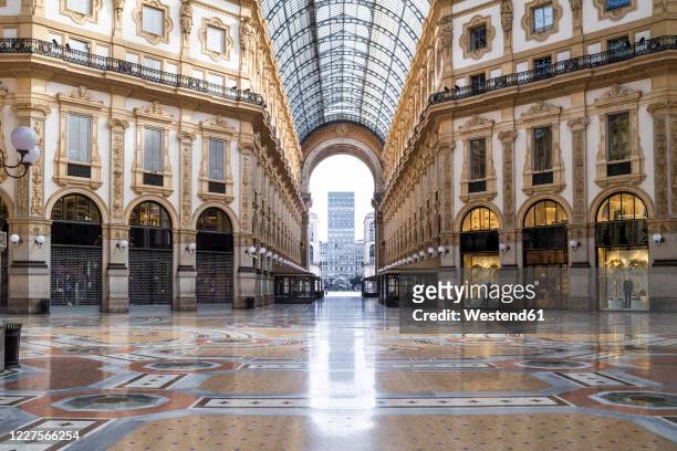 italy, milan, interior of galleriavittorioemanueleii during covid-19 outbreak - milan stock pictures, royalty-free photos & images