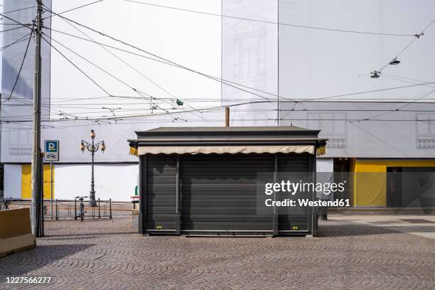 italy, milan, closed booth at piazza cordusio during covid-19 outbreak - booth foto e immagini stock