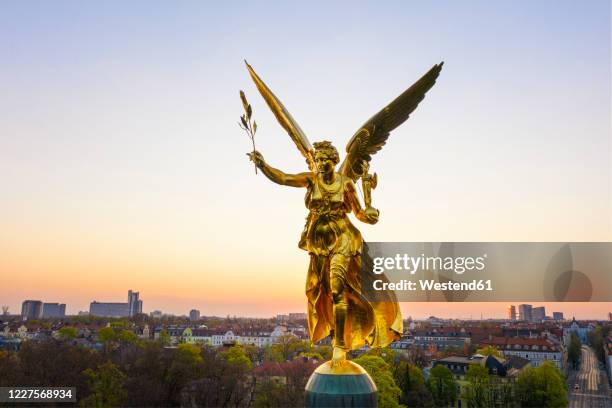 germany, bavaria, munich, drone view of angel of peace monument at sunrise - munich landmark stock pictures, royalty-free photos & images