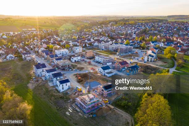 germany, baden-wurttemberg, waiblingen, aerial view of modern suburb at sunset - baden baden aerial fotografías e imágenes de stock