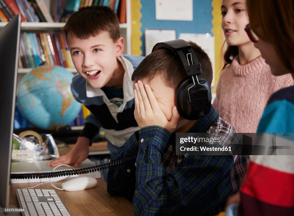 Children Playing Math On Computer Children Playing On A Computer In Classroom High-Res Stock Photo ...