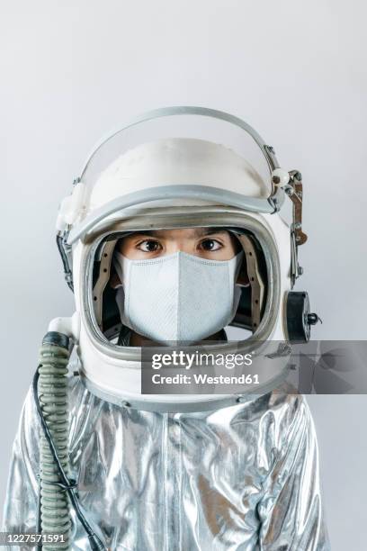 boy wearing space suit and protective mask - space helmet stock pictures, royalty-free photos & images