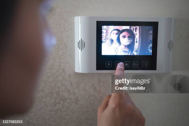 i̇ntercom at covid19 - doorbell stock pictures, royalty-free photos & images