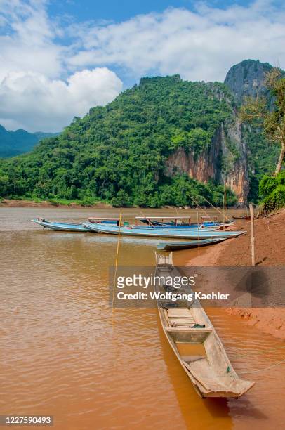 View of excursion boats at the Pak Ou Cave on the Mekong River near Luang Prabang in Central Laos.