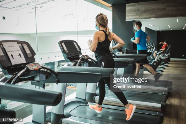 workout in gym after pandemic - gym reopening stock pictures, royalty-free photos & images