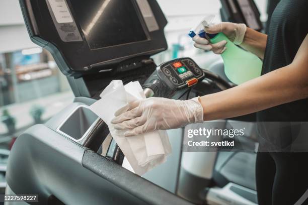 disinfecting treadmill - gym reopening stock pictures, royalty-free photos & images