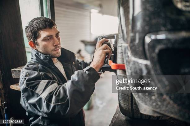 Mechanic Alignment 155 Wheel Alignment And Balancing Stock Photos, High-Res Pictures, and ...