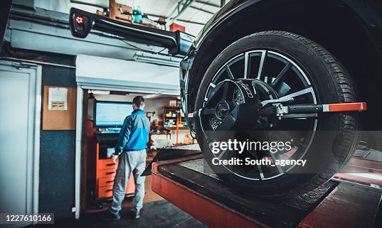 Factory Wheel Alignment Wheel Alignment Equipment On A Car Wheel In A Repair Station High-Res ...