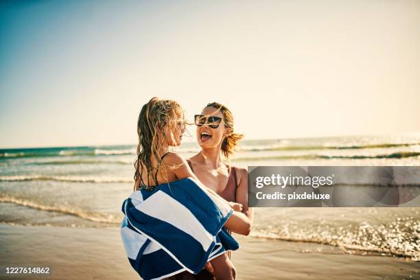 summertime means lots of fun family memories - towel stock pictures, royalty-free photos & images