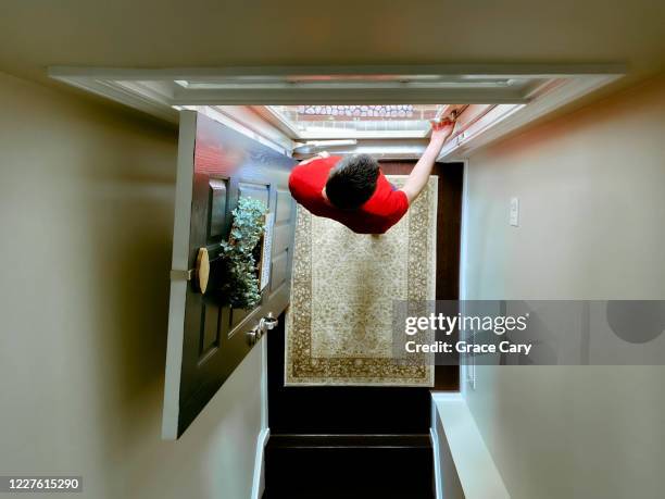man waits at front door for delivery service - welcome mat isolated stock pictures, royalty-free photos & images