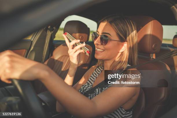 avoid smartphone phone use while driving your car - distracted driving stock pictures, royalty-free photos & images