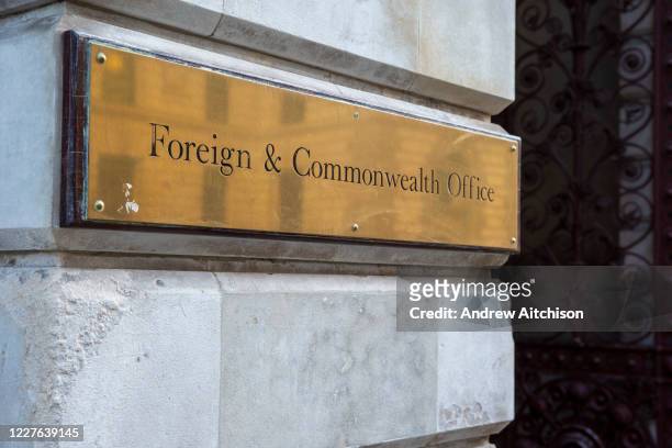 The Foreign and Commonwealth Office brass plaque sign outside the building on the 11th of February 2020 in Westminster, London, United Kingdom.