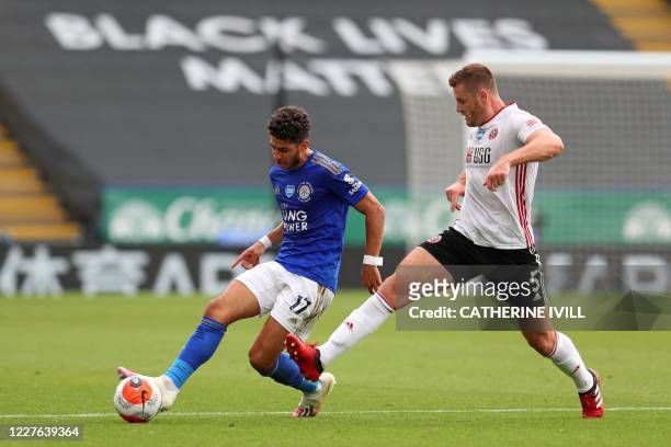Leicester City's Spanish striker Ayoze Perez passes the ball in front of Sheffield United's English defender Jack O'Connell during the English...