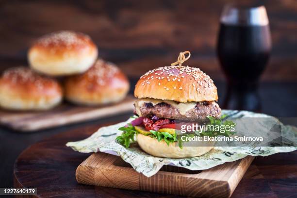 fresh  homemade burger on wooden background, closeup - burger grill stock-fotos und bilder