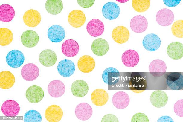 multicolored confetti on a white background. festive holiday concept - polka dot stock pictures, royalty-free photos & images