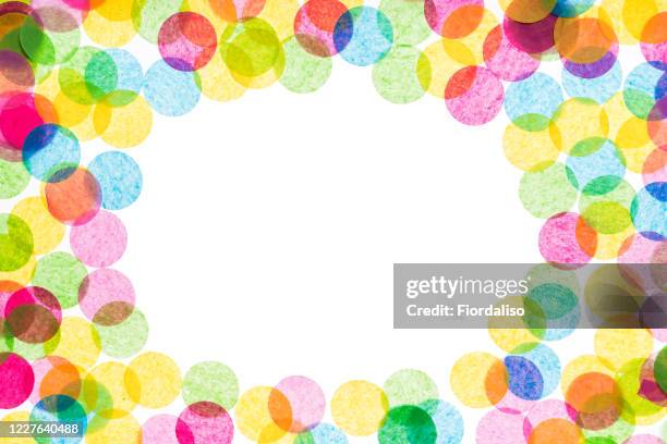 multicolored confetti on a white background. festive holiday concept - colorful polka dot background stock pictures, royalty-free photos & images