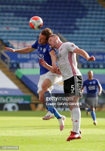 Sheffield United's English defender Jack O'Connell jumps to head the ball against Leicester City's English striker Jamie Vardy during the English...