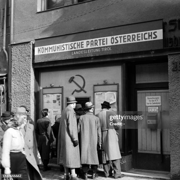 People read posters at the headquarters of the Communist Party of Austria in January 1946 in Innsbruck, Austria.
