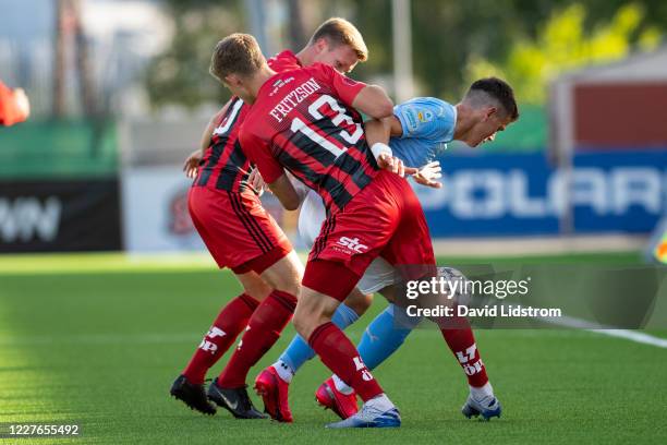 Ludvig Fritzson of Ostersunds FK and Jonas Knudsen of Malmo FF during the Allsvenskan match between Ostersunds FK and Malmo FF at Jamtkraft Arena on...