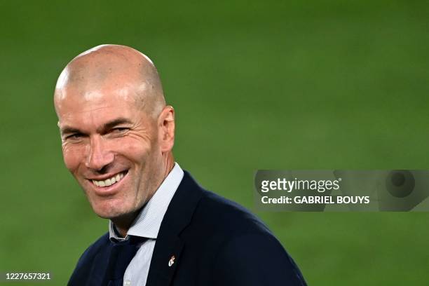 Real Madrid's French coach Zinedine Zidane celebrates winning the Liga title after the Spanish League football match between Real Madrid CF and...