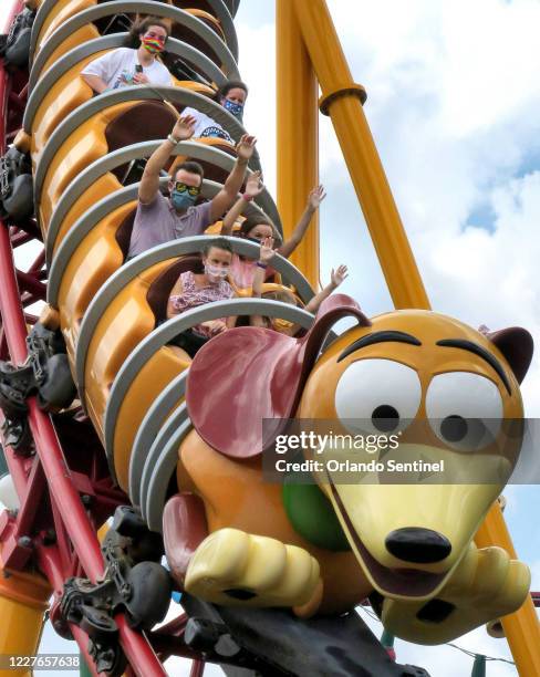 Guests ride the Slinky Dog Dash roller coaster on the second day of the re-opening of Disney's Hollywood Studios at Walt Disney World, in Lake Buena...