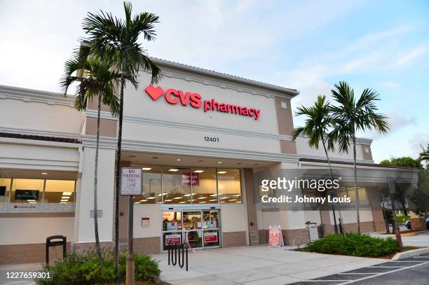View outside a CVS Pharmacy store on July 16, 2020 in Miramar, Florida. Some major U.S. Corporations are requiring masks to be worn in their stores...