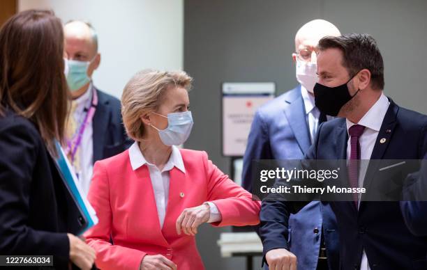 President of the European Commission Ursula von der Leyen elbow bumps Luxembourg Prime Minister Xavier Bettel during an EU summit on July 17, 2020 in...
