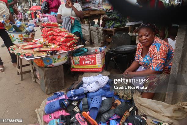 Traders sell in Agege, Lagos, Nigeria on Wednesday, July 15, 2020. Economic activities are bouncing back gradually after the government relaxed...