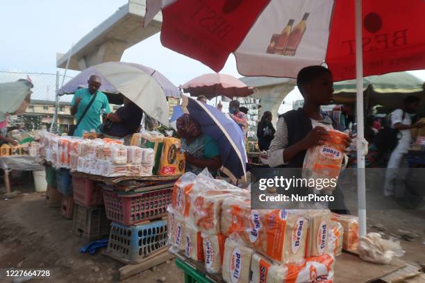 Bread sellers display at roadside in Agege, Lagos, Nigeria on Friday, July 3, 2020. Economic activities are bouncing back gradually after the...