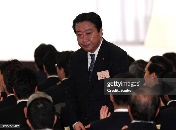 Finance Minister Yoshihiko Noda bows as he was elected the new Democratic Party of Japan president during the DPJ lawmakers general assembly on...