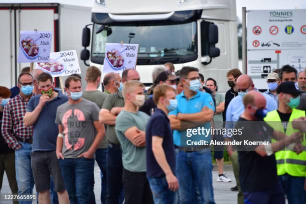 Farmers and pro Toennies demonstrators protest outside the Toennies slaughterhouse and meat packing plant as the facility reopens following an...