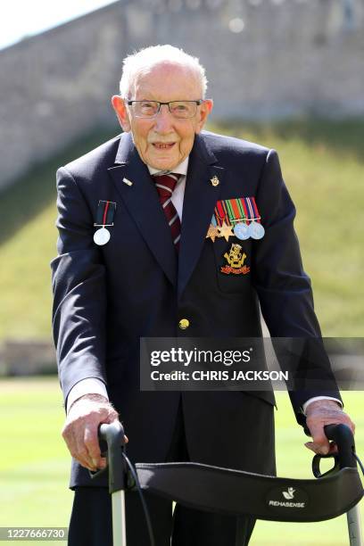 Year-old WWII veteran Captain Tom Moore attends an investiture where he will be made a Knight Bachelor during at Windsor Castle in Windsor, west of...