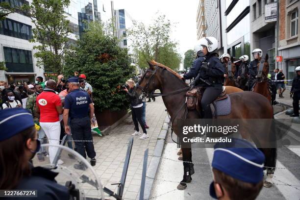 Security forces and mounted police take measures during a protest against French President Emmanuel Macron as he is attending the EU leaders' meeting...