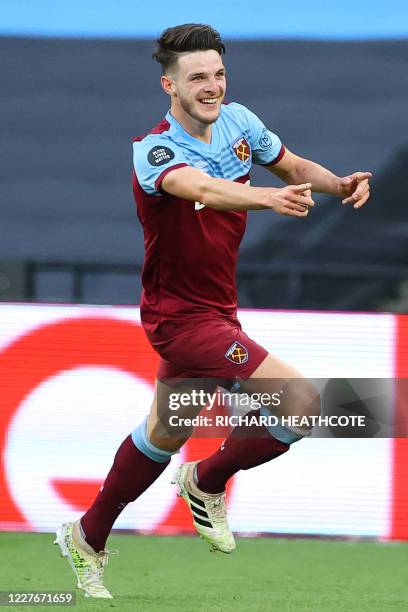 West Ham United's English midfielder Declan Rice celebrates after scoring their third goal during the English Premier League football match between...