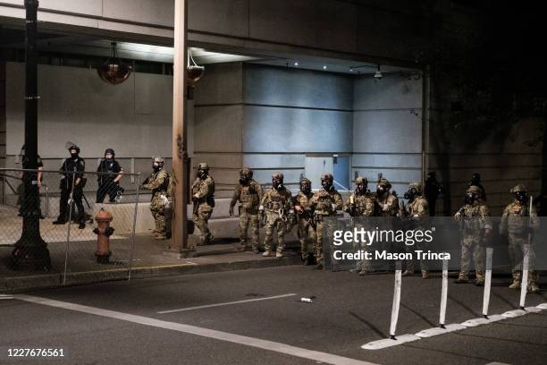 Federal officers prepare to disperse the crowd of protestors outside the Multnomah County Justice Center on July 17, 2020 in Portland, Oregon....