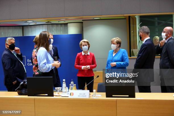 President of the European Commission Ursula von der Leyen , German Chancellor Angela Merkel , President of the European Council Charles Michel and...