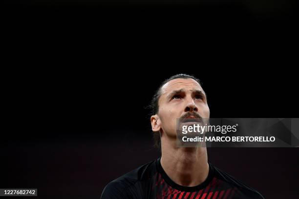 Milan's forward Zlatan Ibrahimovic from Sweden looks on during the warm up before the Italian Serie A football match AC Milan vs Bologna played...