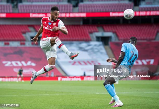 Pierre-Emerick Aubameyang of Arsenal and Benjamin Mendy of Manchester City in action during the FA Cup Semi Final match between Arsenal and...