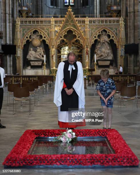 Or COLOURABLY SIMILAR. Reverend Anthony Ball, Canon of Westminster in Westminster Abbey in London with Toby Wright, son of the Reverend Paul Wright,...