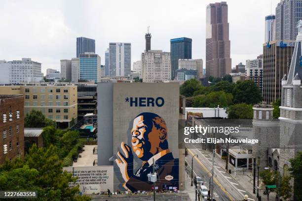 In this drone image, a mural of U.S. Rep John Lewis is seen on the side of a building on July 18, 2020 in Atlanta, Georgia. John Lewis, died at 80...