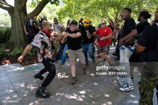 Member of the Boogaloo Movement wearing a Hawaiian shirt gets into a physical altercation with members of the Proud Boys in front of the Ohio...