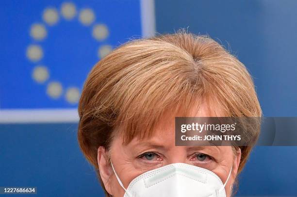 German Chancellor Angela Merkel arrives for a meeting of an EU summit on a coronavirus recovery package at the European Council building in Brussels...
