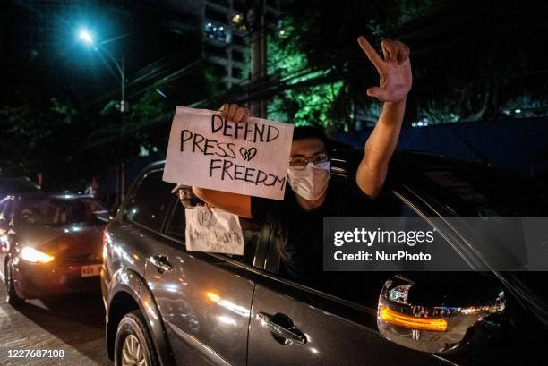 Employees and supporters of Philippine broadcast network ABS-CBN join a noise barrage outside the media giants headquarters in Quezon City,...