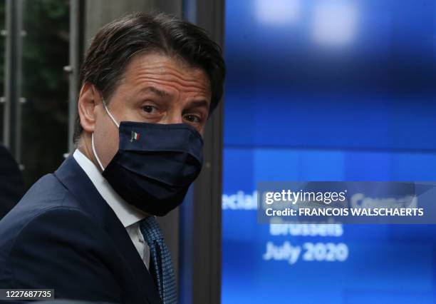 Italy's Prime Minister Giuseppe Conte arrives for the EU summit on a coronavirus recovery package at the European Council building in Brussels on...