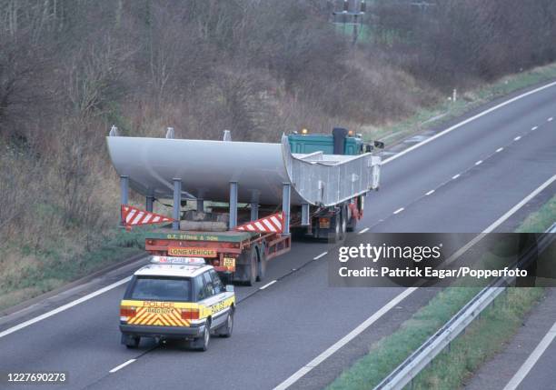 Section of the prefabricated aluminium shell of the new Lord's Media Centre is transported with a police escort from the Pendennis Shipyard in...