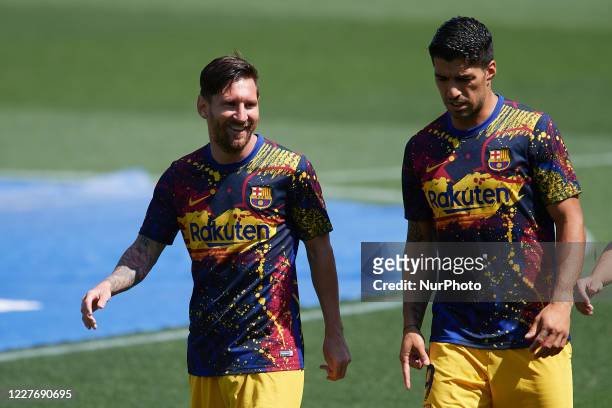 Lionel Messi and Luis Suarez of Barcelona during the warm-up before the Liga match between Deportivo Alaves and FC Barcelona at Estadio de...