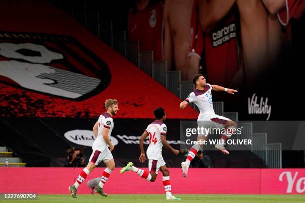 Southampton's English midfielder Che Adams celebrates scoring his team's second goal during the English Premier League football match between...